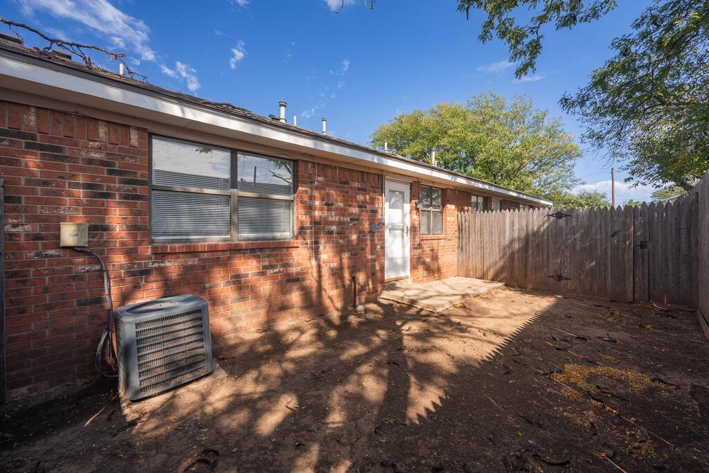 4200 South Austin Street, Unit B Amarillo, TX 79110 - Photo 13 of 13 a backyard of a house with table and chairs