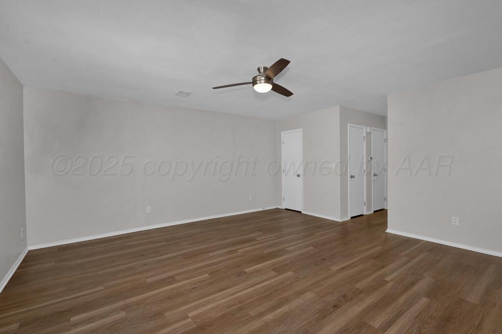 4200 South Austin Street, Unit B Amarillo, TX 79110 - Photo 2 of 13 a view of empty room with wooden floor