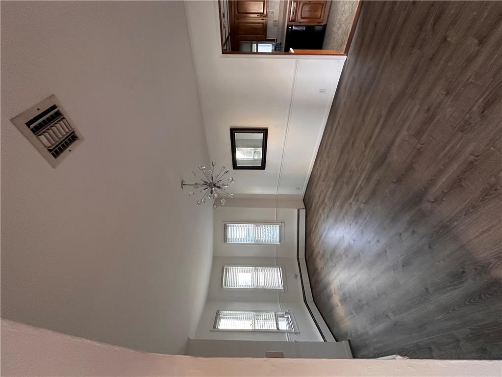 5128 3rd Street Whitehall, PA 18052 - Photo 13 of 26 Natural light filters into a spacious living area featuring contemporary flooring.