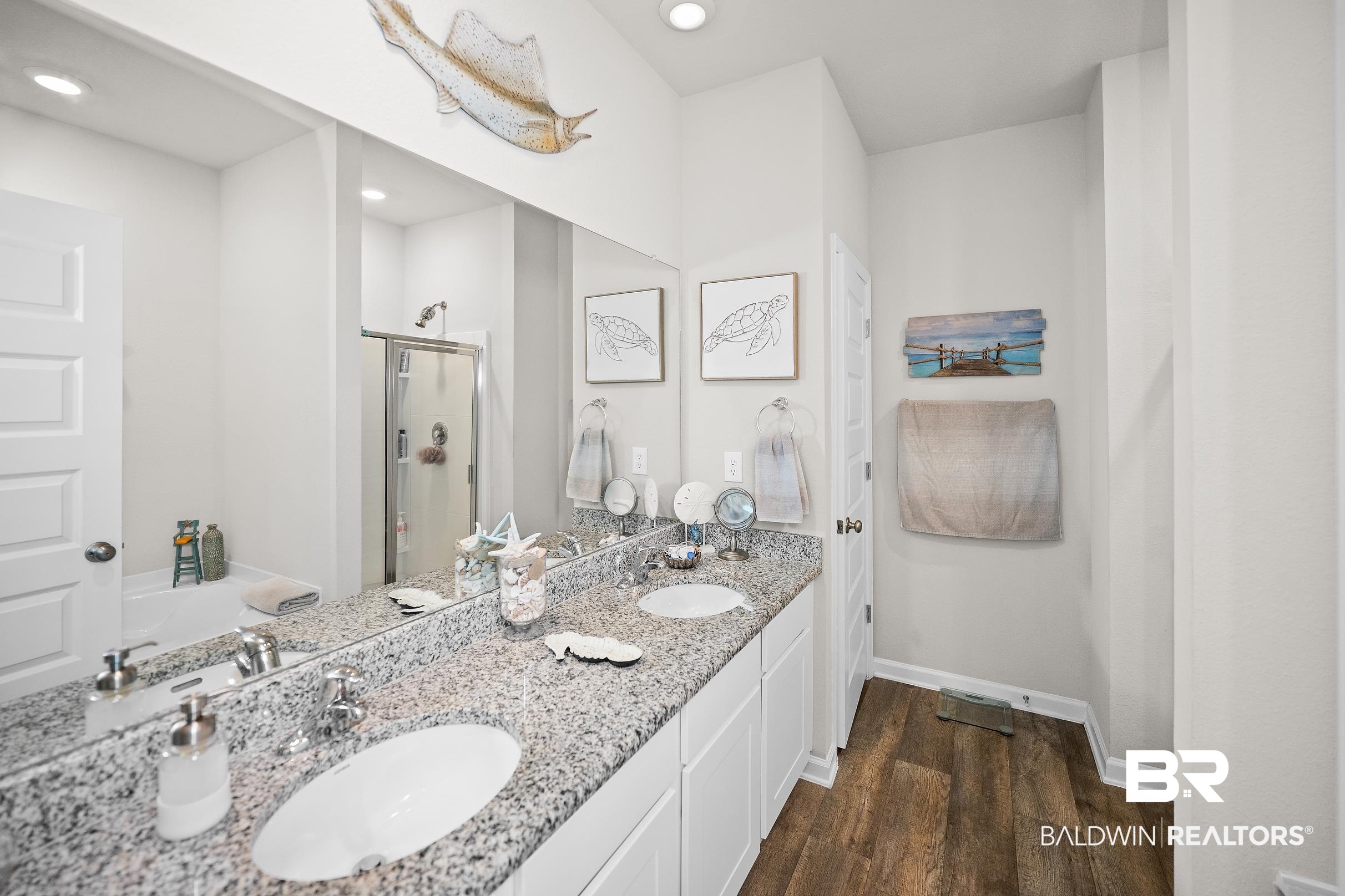 23997 Veranda Circle Elberta, AL 36530 - Photo 16 of 28 Dual vanity featuring white shaker-style cabinetry, a speckled countertop, and undermount sinks