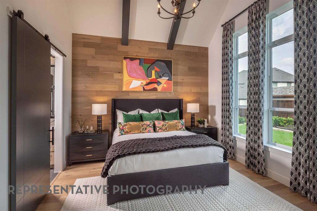 930 Heatherbrook Drive Prosper, TX 75078 - Photo 13 of 37 a bedroom with a bed and a window