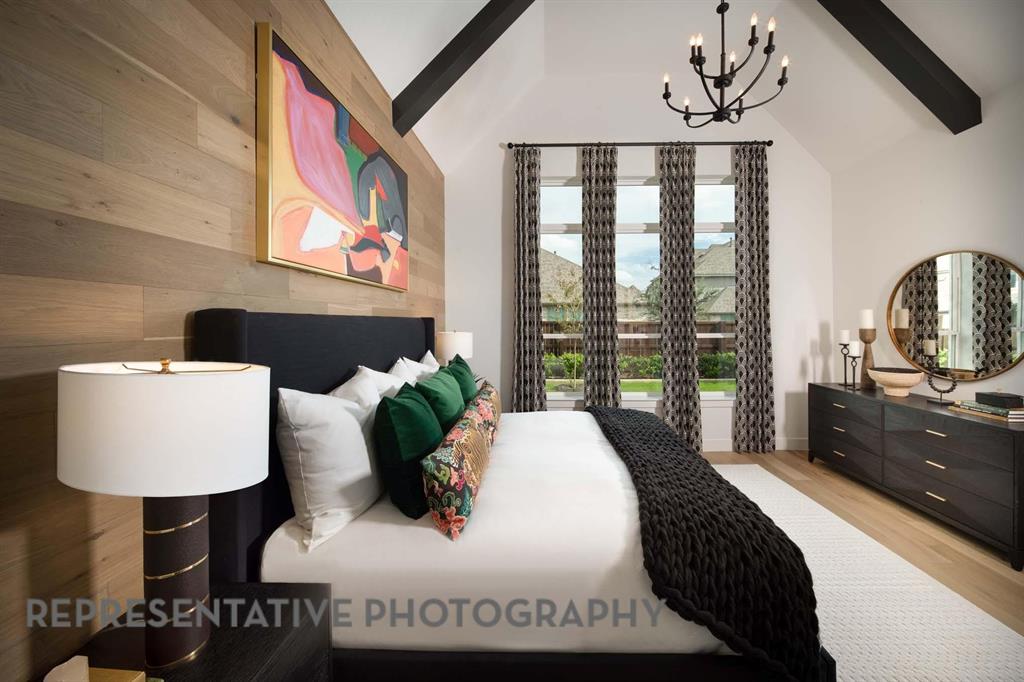 930 Heatherbrook Drive Prosper, TX 75078 - Photo 14 of 37 a bed sitting in a bedroom next to a window