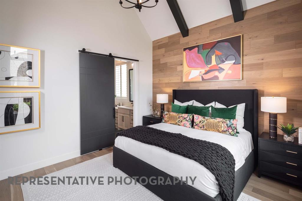 930 Heatherbrook Drive Prosper, TX 75078 - Photo 15 of 37 a bedroom with a bed and a painting on the wall