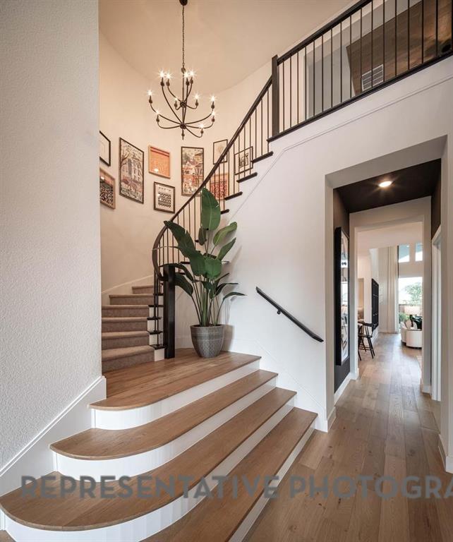 930 Heatherbrook Drive Prosper, TX 75078 - Photo 30 of 37 a view of entryway and hall with wooden floor