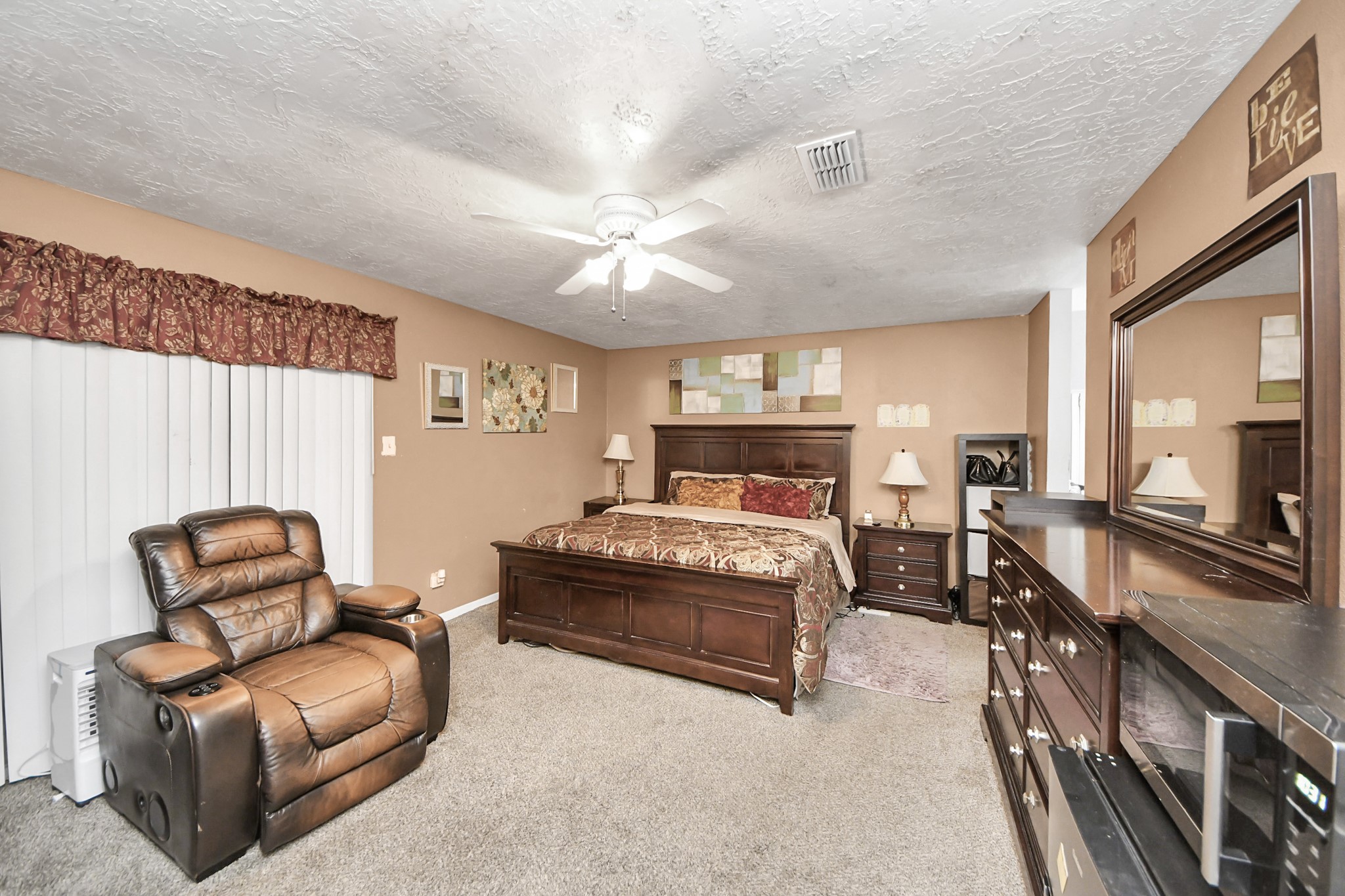 4155 Amir Street Houston, TX 77072 - Photo 35 of 43 a bedroom with furniture and a large window