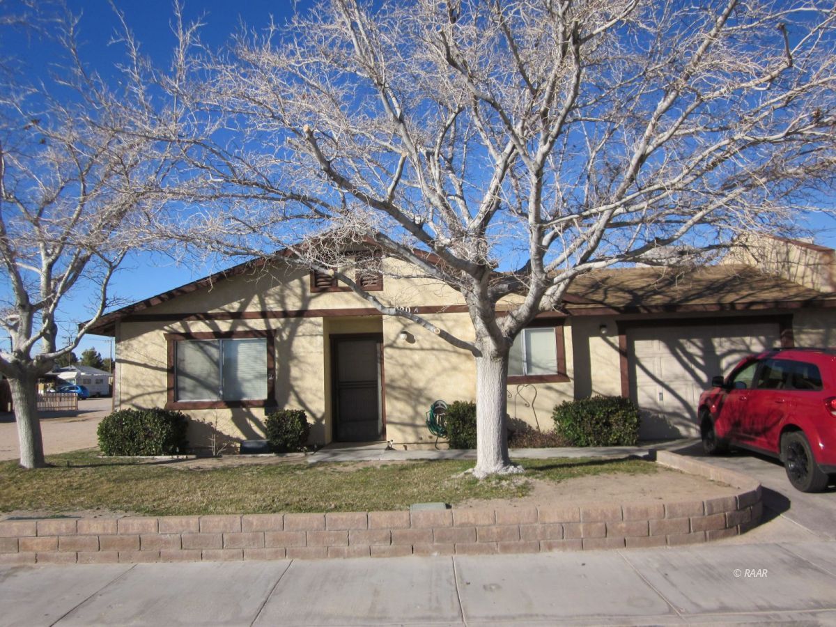 920 East California Avenue Ridgecrest, CA 93555 - Photo 1 of 1 a view of a house with a yard and garage