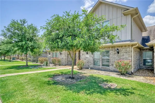 a backyard of a house with lots of green space