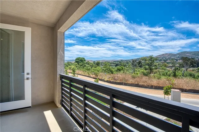a view of a back yard from a balcony