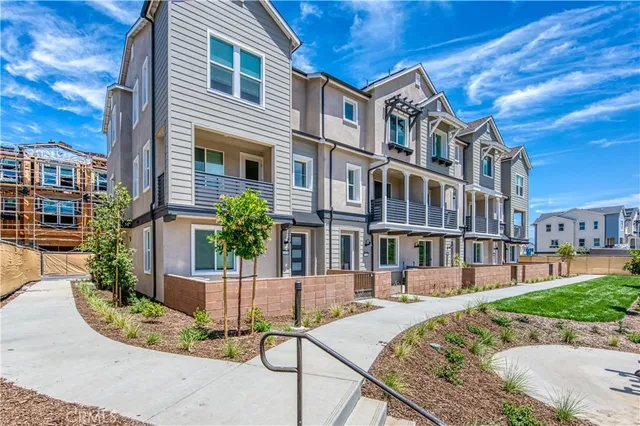 a view of a brick building with a yard