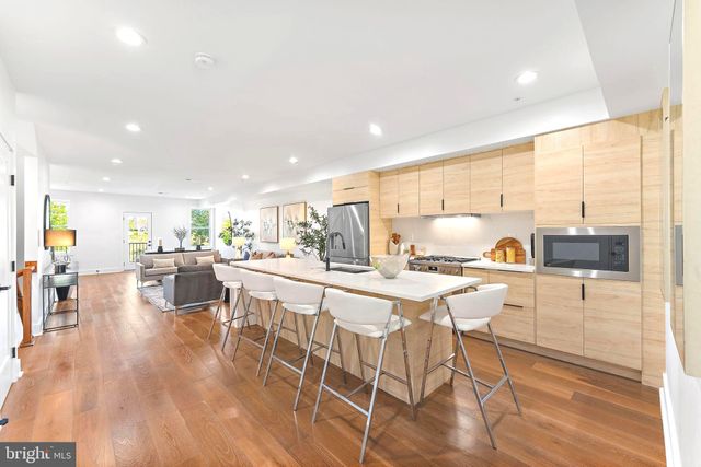 a view of a dining area with furniture window and wooden floor
