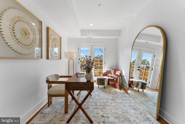 a view of a livingroom with furniture and a potted plant