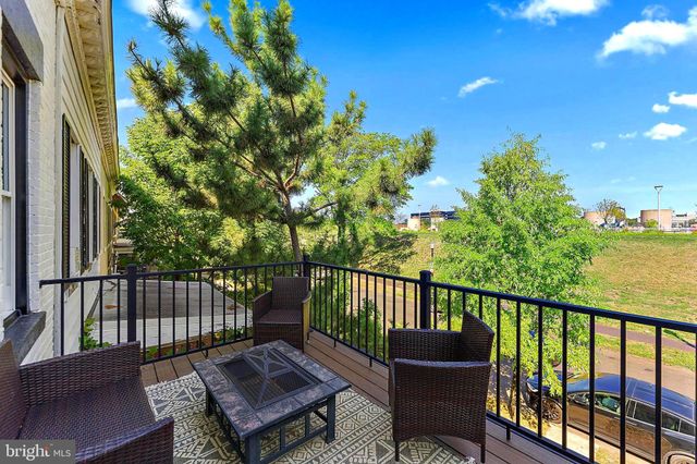 a view of a chair and table on the deck