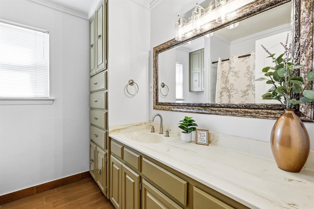 816 Ruidoso Drive Saginaw, TX 76179 - Photo 11 of 22 a bathroom with a sink and a mirror