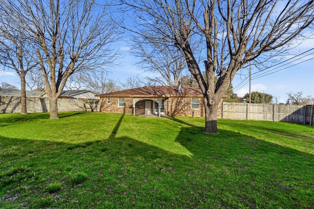 816 Ruidoso Drive Saginaw, TX 76179 - Photo 16 of 22 a view of a house with a yard