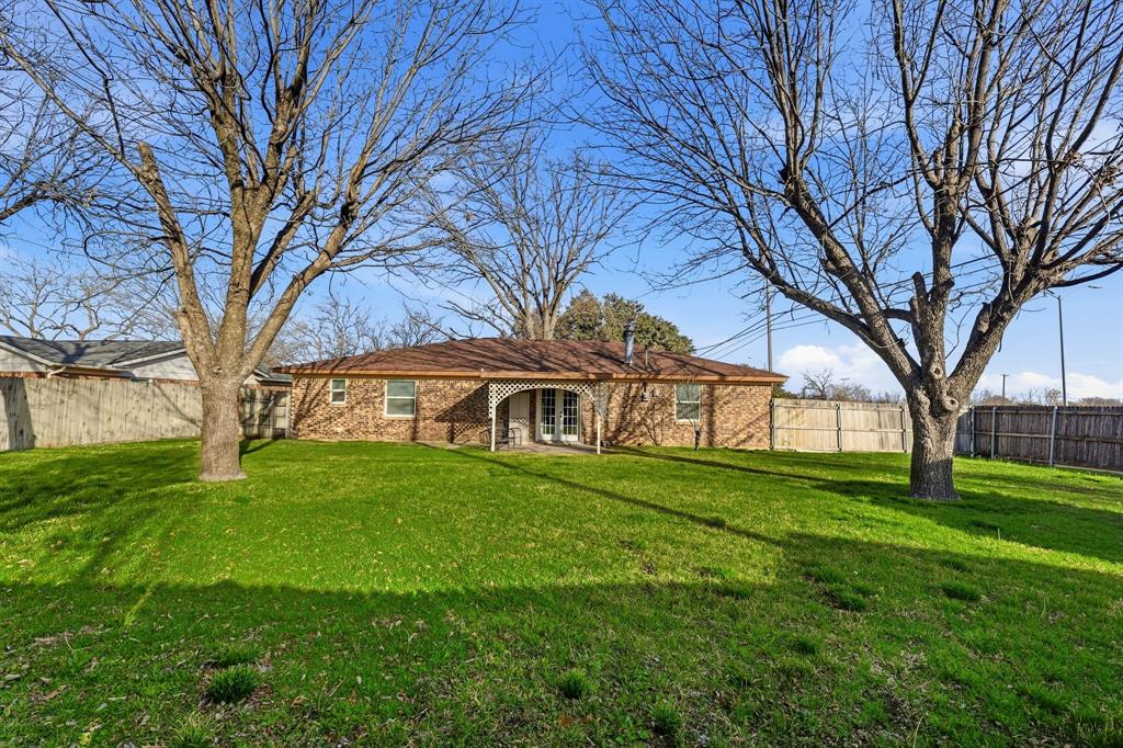 816 Ruidoso Drive Saginaw, TX 76179 - Photo 17 of 22 a front view of house with yard and green space
