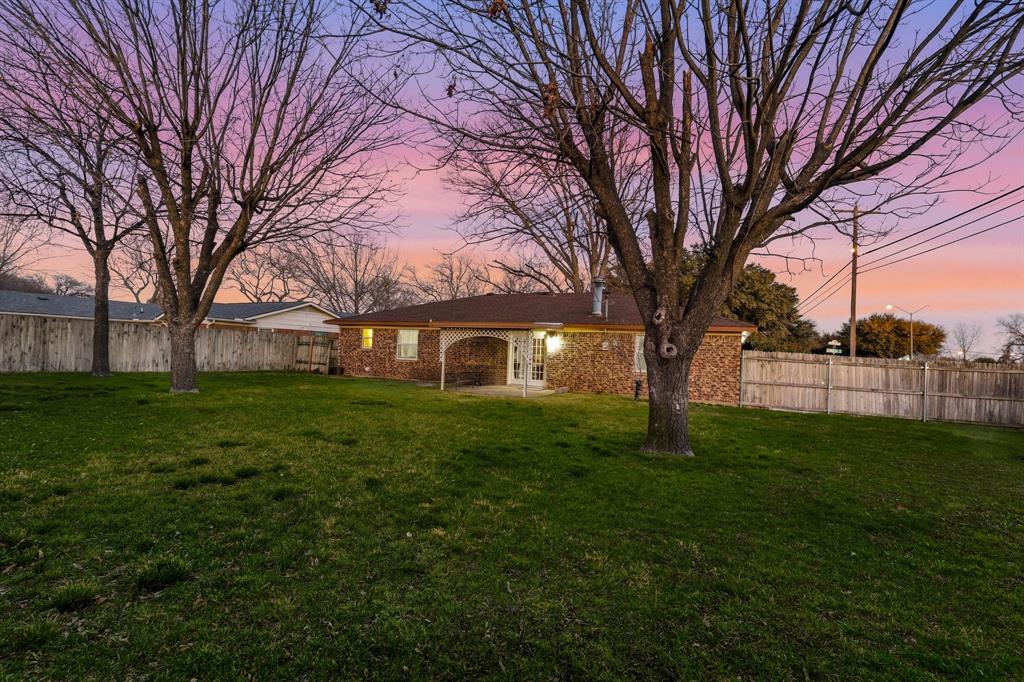 816 Ruidoso Drive Saginaw, TX 76179 - Photo 19 of 22 a view of a house with a yard