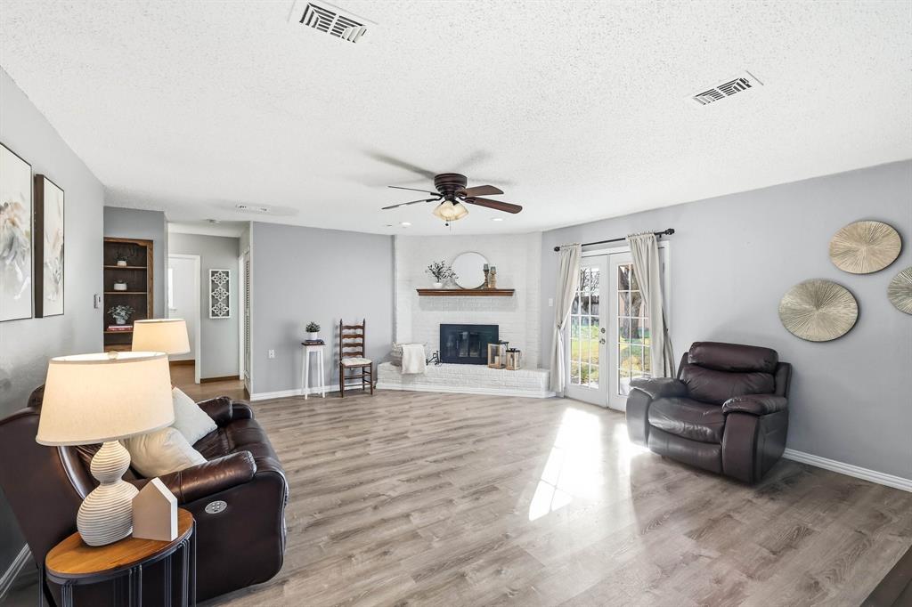816 Ruidoso Drive Saginaw, TX 76179 - Photo 5 of 22 a living room with furniture and a fireplace
