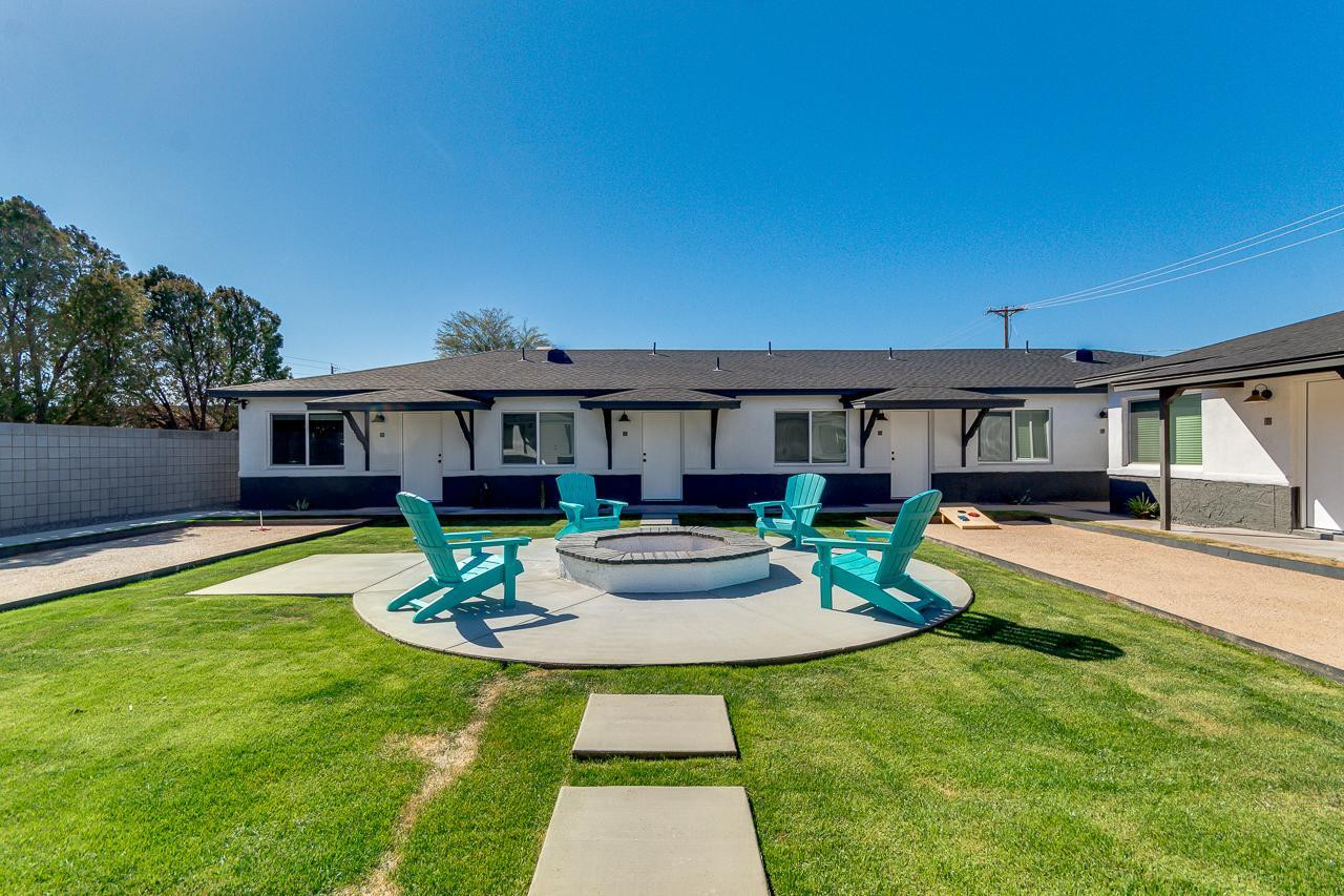 2512 East Thomas Road, Unit 1 Phoenix, AZ 85016 - Photo 15 of 24 a front view of a house with a yard table and chairs