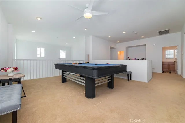 a room with furniture and pool table