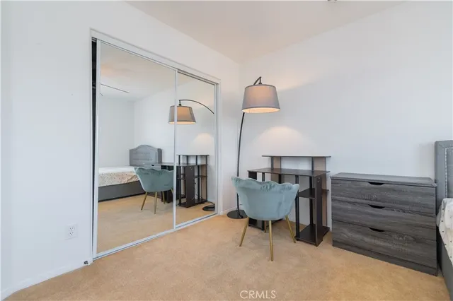 a living room with furniture and a chair