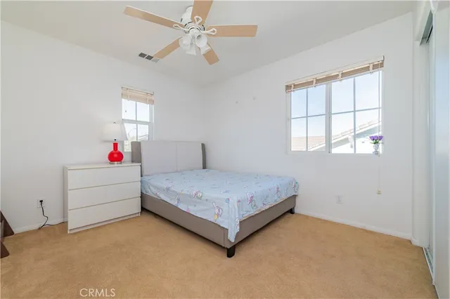 a bed room with a bed and window