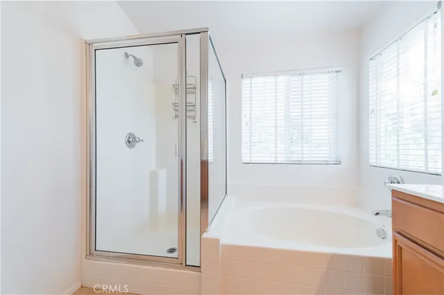 a white bath tub sitting next to a window
