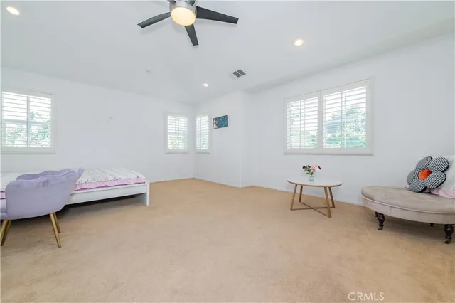 a bedroom with furniture and a window