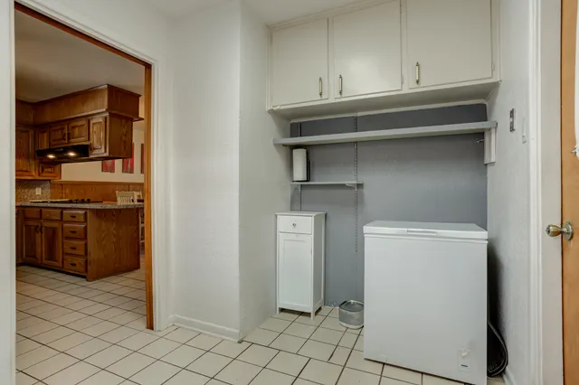 a kitchen with a cabinets and appliances