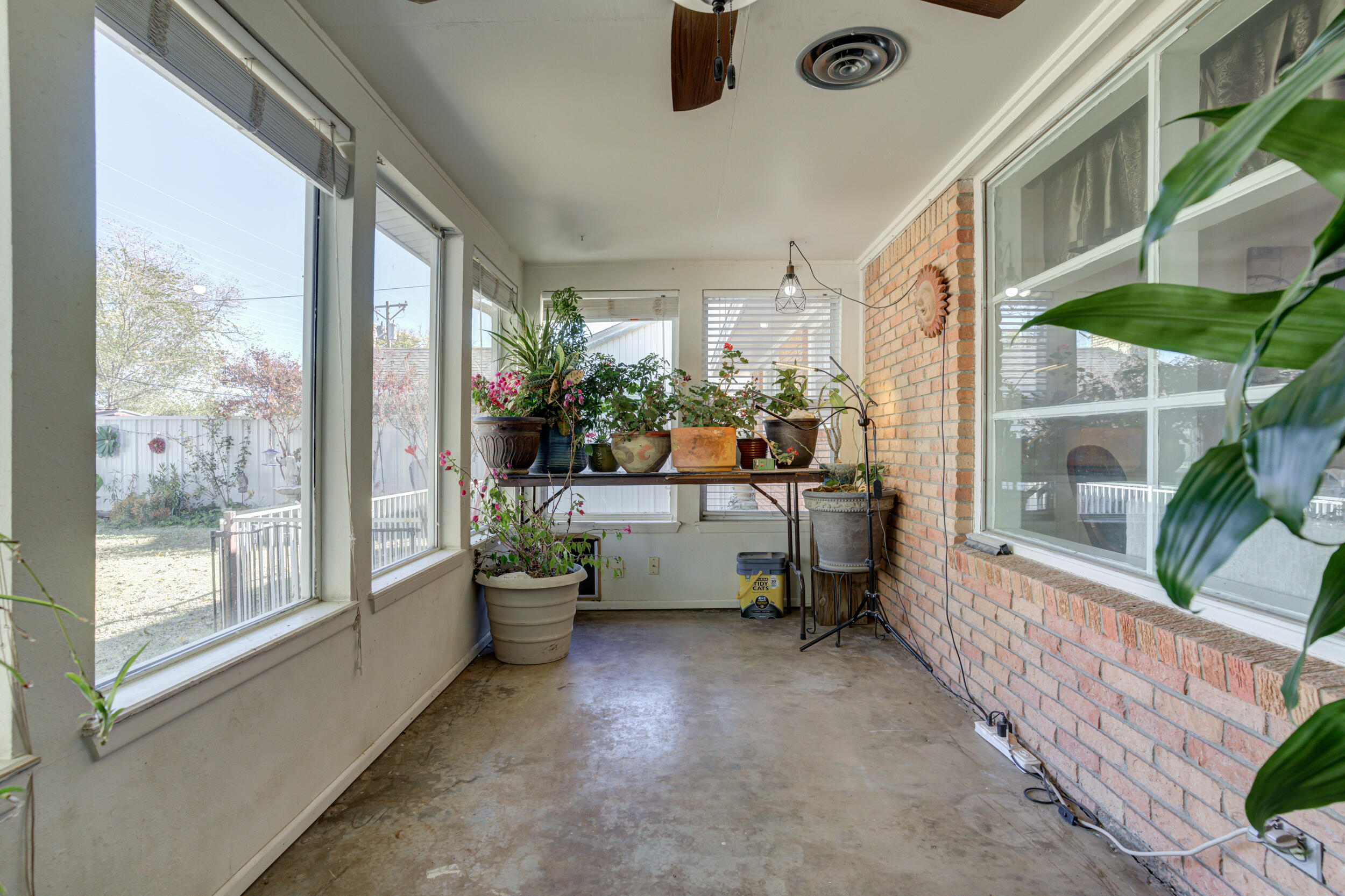 2120 53rd Street Lubbock, TX 79412 - Photo 25 of 32 a balcony filled with furniture and windows