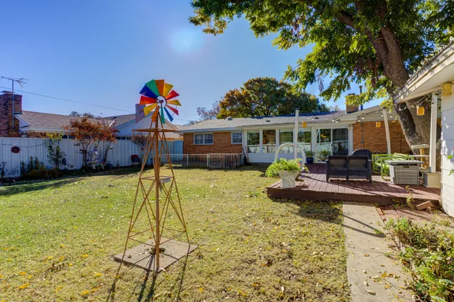 a view of a house with swimming pool and sitting area