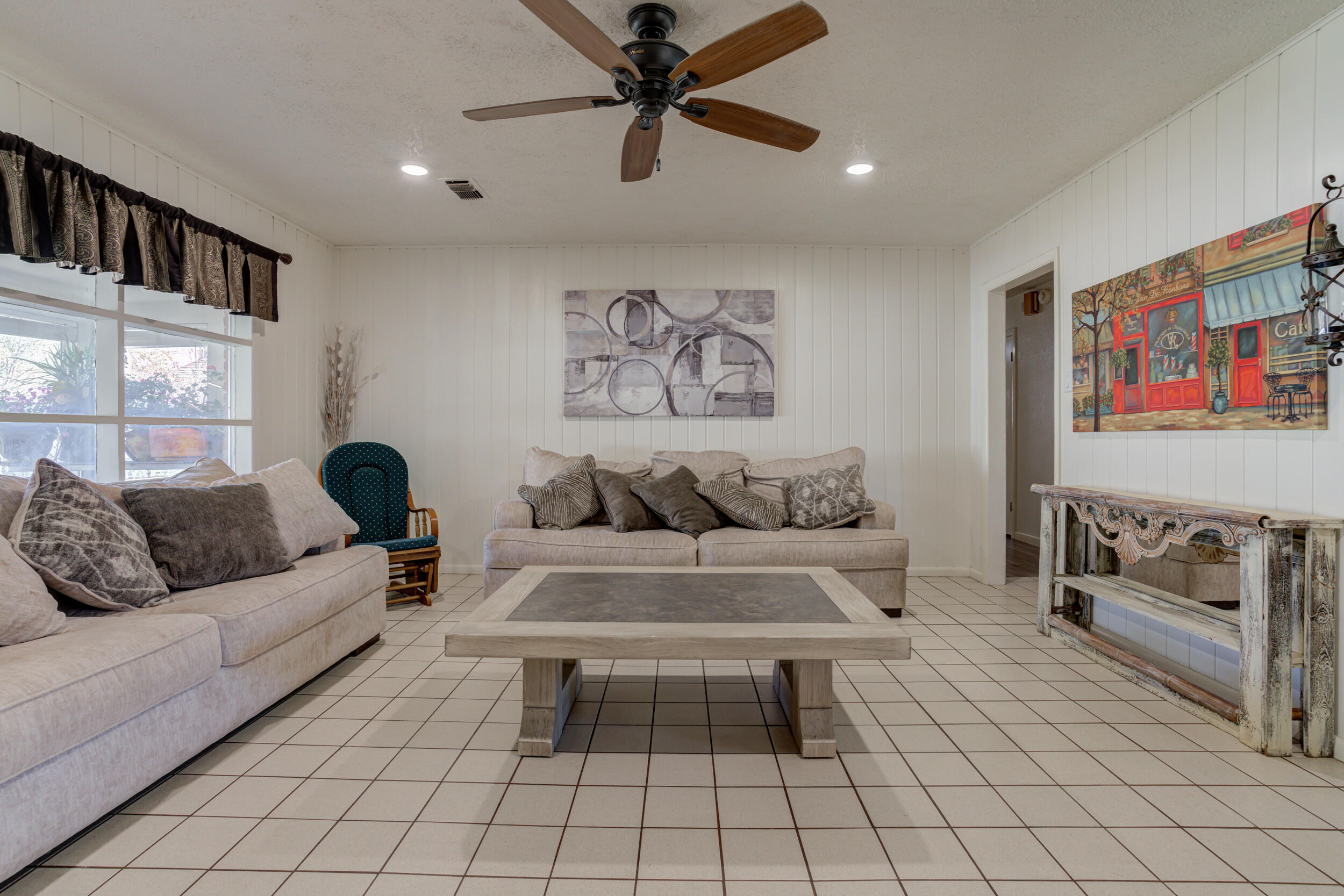 2120 53rd Street Lubbock, TX 79412 - Photo 6 of 32 a living room with furniture and a rug