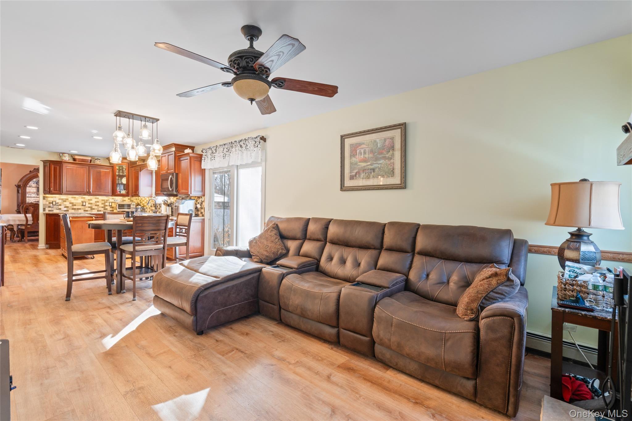 194 Miller Place Road Miller Place, NY 11764 - Photo 17 of 50 a living room with furniture and a chandelier