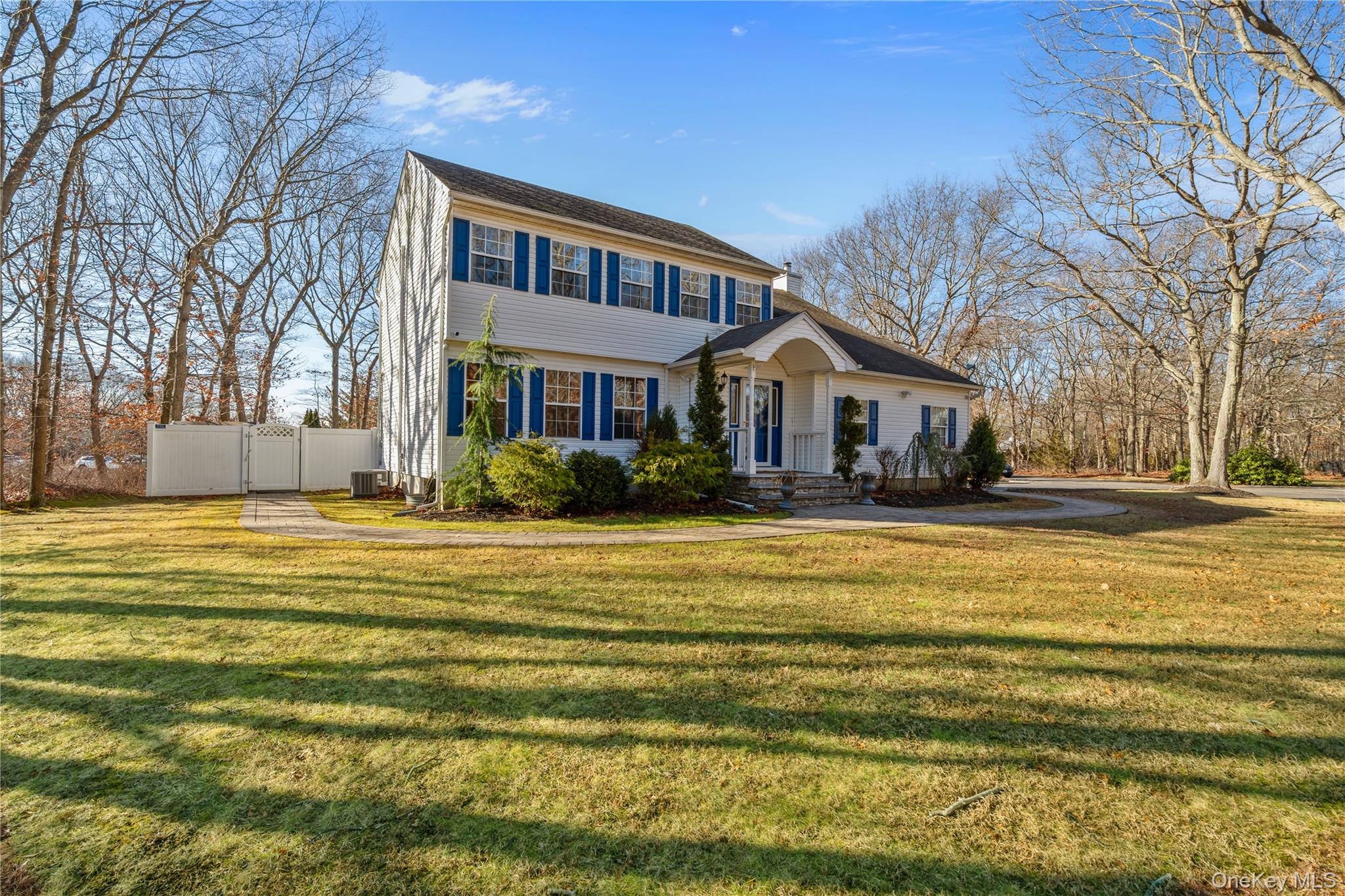 194 Miller Place Road Miller Place, NY 11764 - Photo 2 of 50 a front view of house with yard and trees around