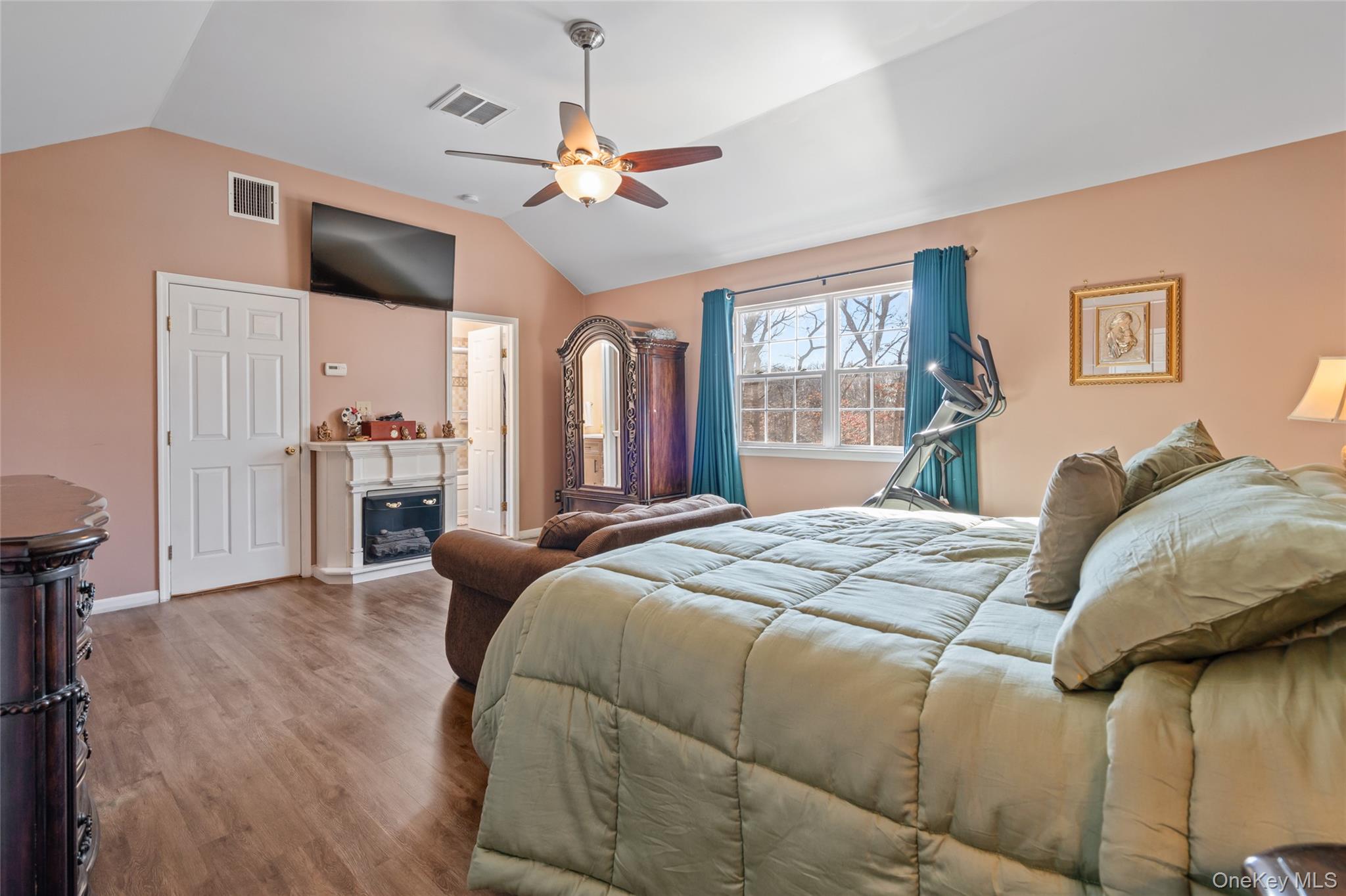 194 Miller Place Road Miller Place, NY 11764 - Photo 21 of 50 a bed sitting in a bedroom next to a window