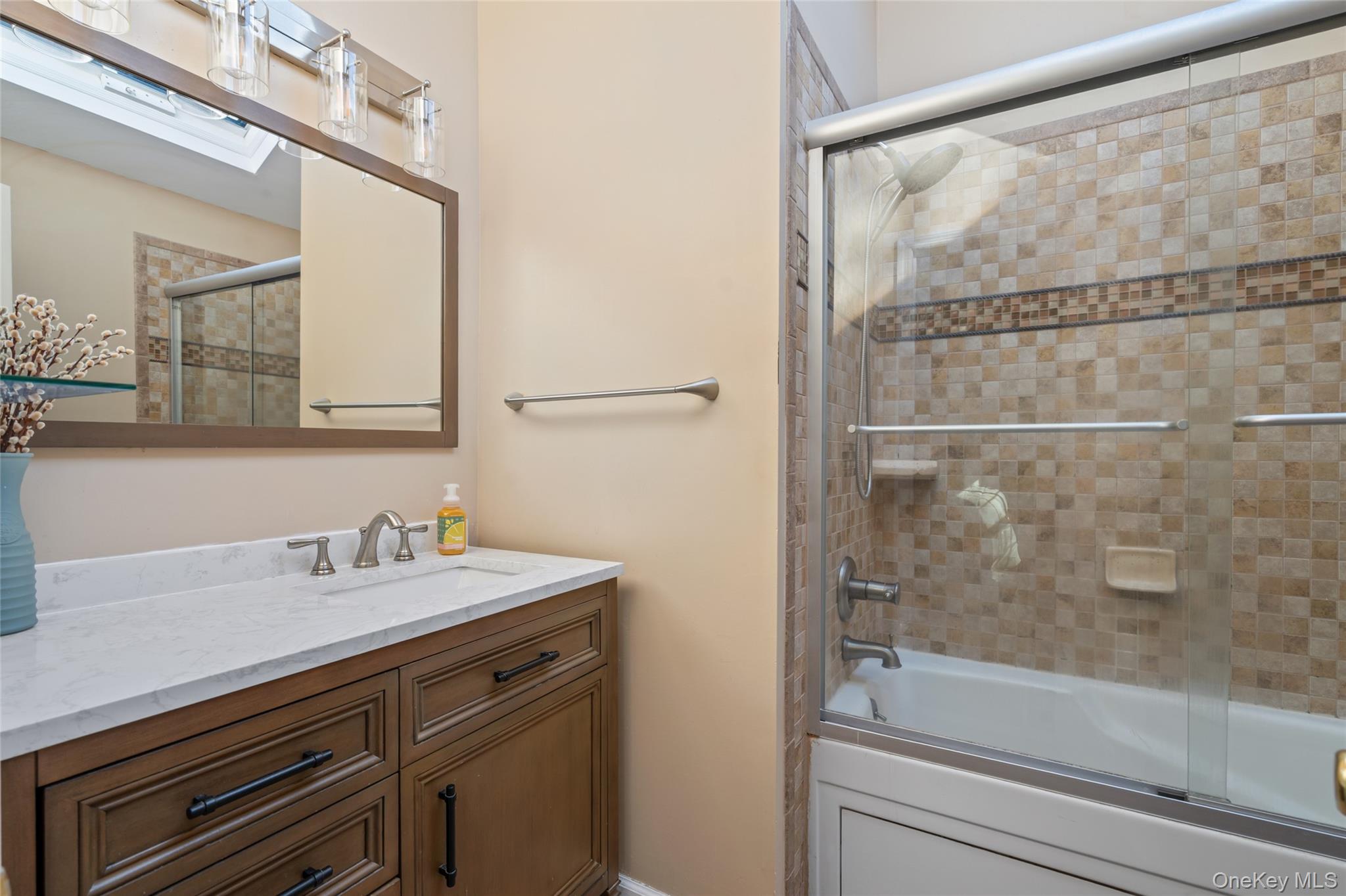194 Miller Place Road Miller Place, NY 11764 - Photo 23 of 50 a bathroom with a sink and a mirror