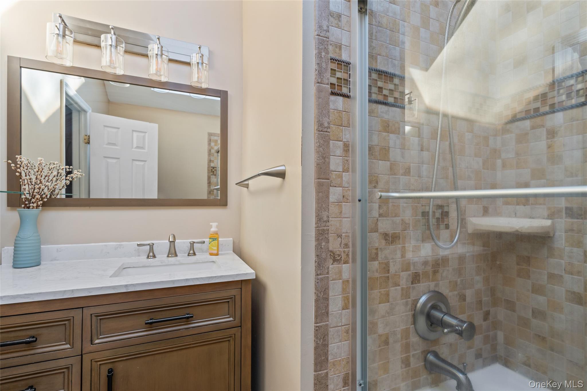 194 Miller Place Road Miller Place, NY 11764 - Photo 25 of 50 a bathroom with a granite countertop sink a mirror and shower