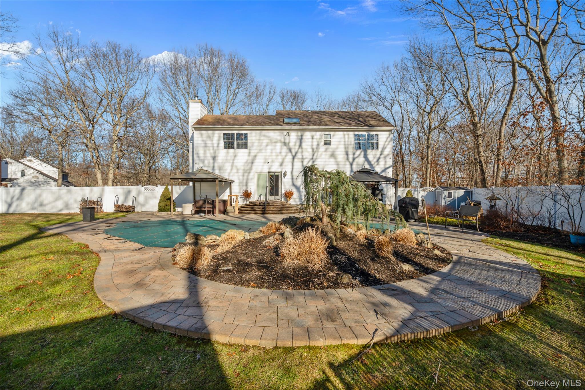 194 Miller Place Road Miller Place, NY 11764 - Photo 40 of 50 a view of a house with backyard and sitting area
