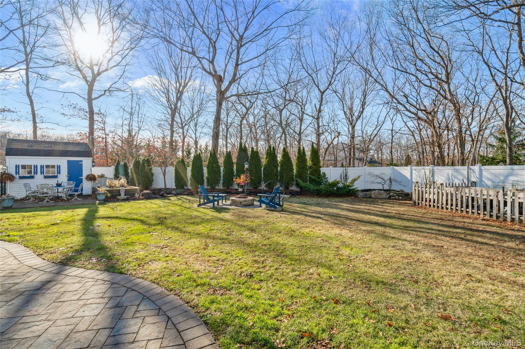 194 Miller Place Road Miller Place, NY 11764 - Photo 43 of 50 a view of swimming pool and trees in the background