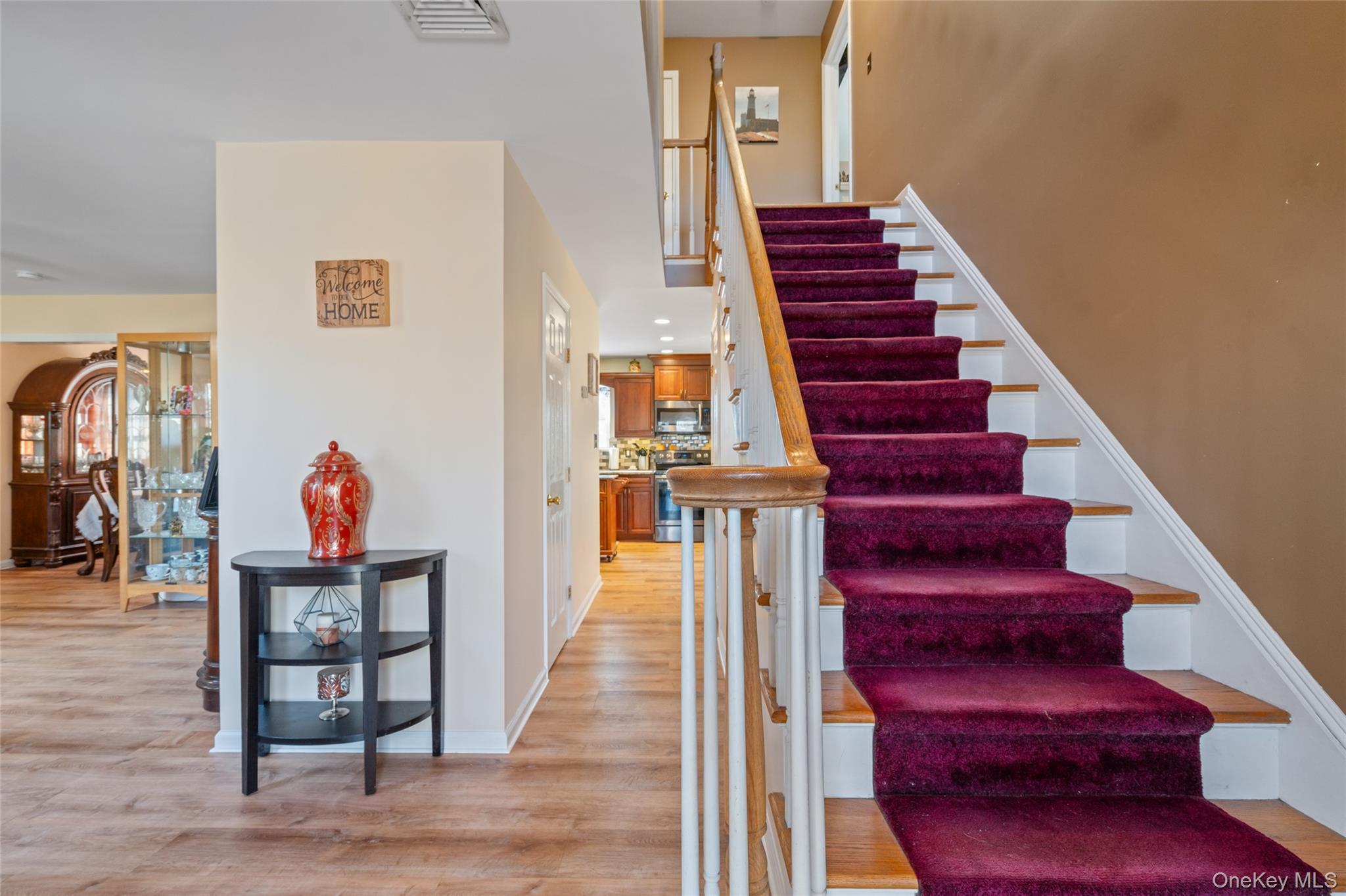 194 Miller Place Road Miller Place, NY 11764 - Photo 5 of 50 a view of entryway and hall with wooden floor