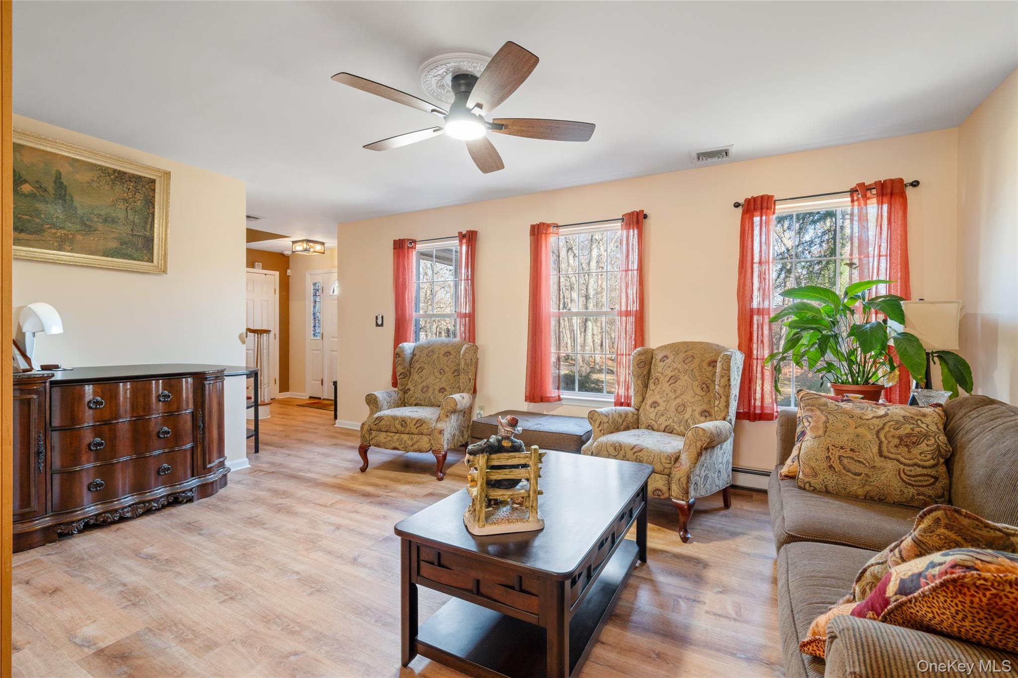 194 Miller Place Road Miller Place, NY 11764 - Photo 8 of 50 a living room with furniture and a large window