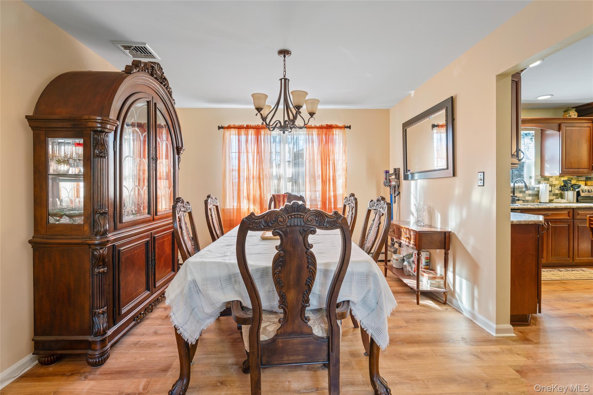 194 Miller Place Road Miller Place, NY 11764 - Photo 9 of 50 a view of a dining room with furniture window and wooden floor