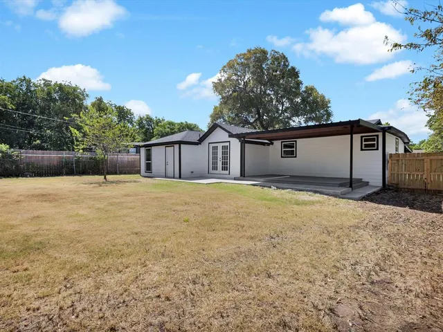 a house view with swimming pool in front of it