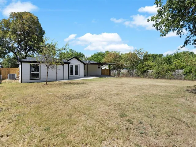 a house with trees in front of it