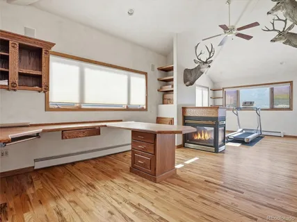 a kitchen with sink cabinets and wooden floor
