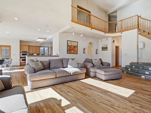 a large bedroom with furniture and a view of bathroom