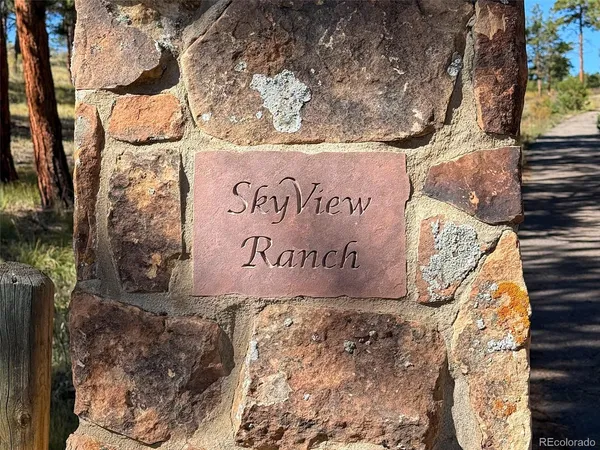 a sign broad on a brick wall