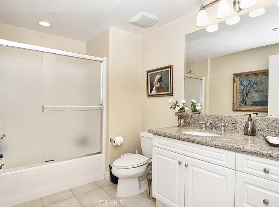 135 Pathway Irvine, CA 92618 - Photo 11 of 12 a bathroom with a granite countertop sink a toilet and shower