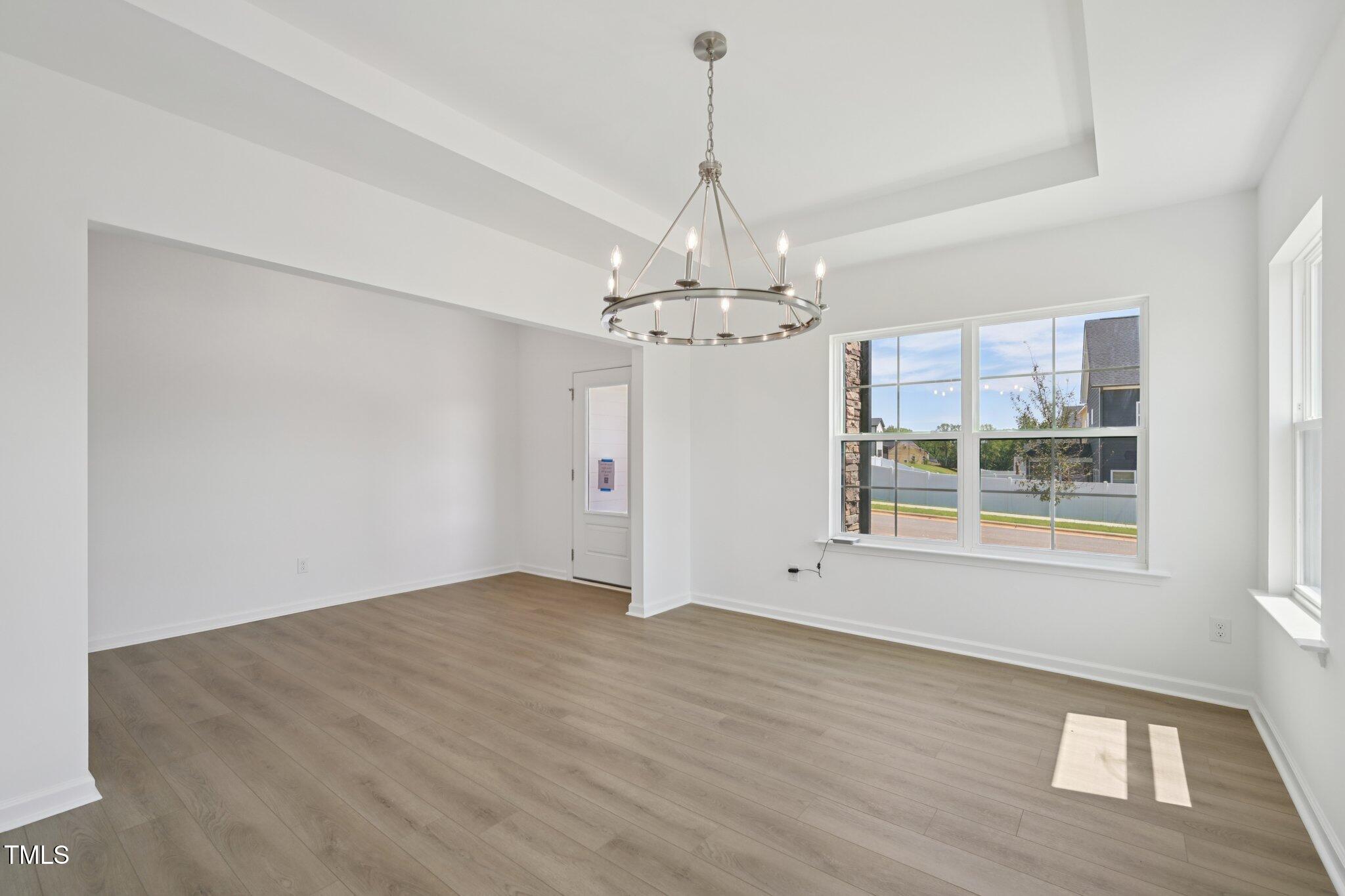 1609 Malcus Court, Unit 67 Fuquay-Varina, NC 27526 - Photo 13 of 40 a view of an empty room with a window