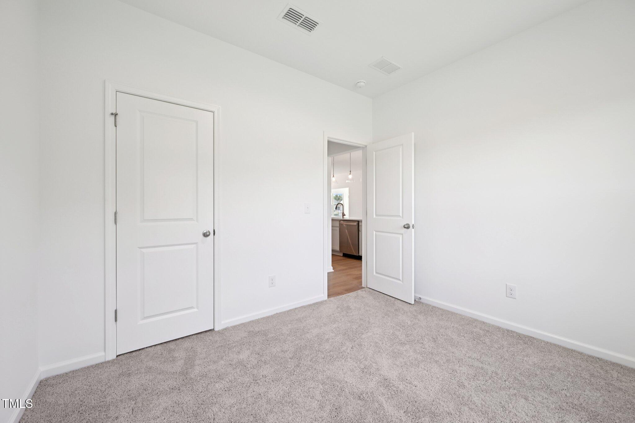 1609 Malcus Court, Unit 67 Fuquay-Varina, NC 27526 - Photo 20 of 40 a view of an empty room