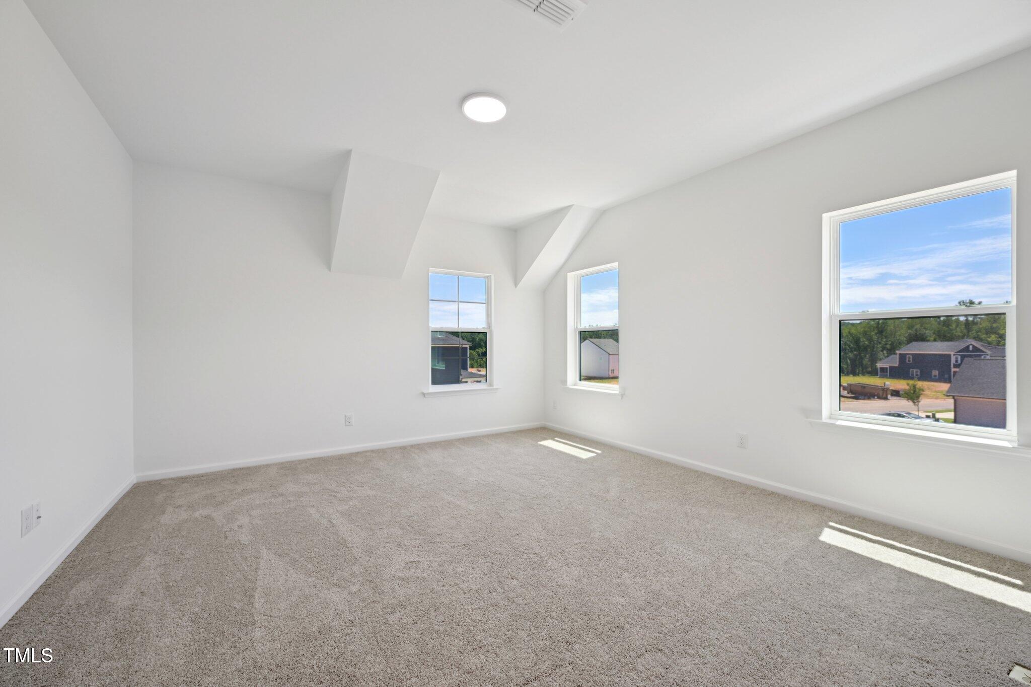1609 Malcus Court, Unit 67 Fuquay-Varina, NC 27526 - Photo 21 of 40 an empty room with a window